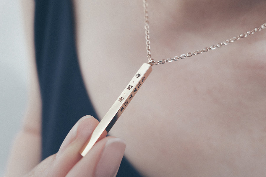 Gold necklace with vertical bar sale pendant